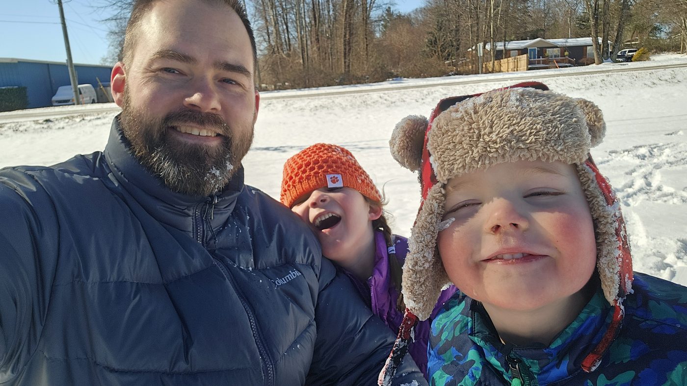 Cody and his two kids on a snow day